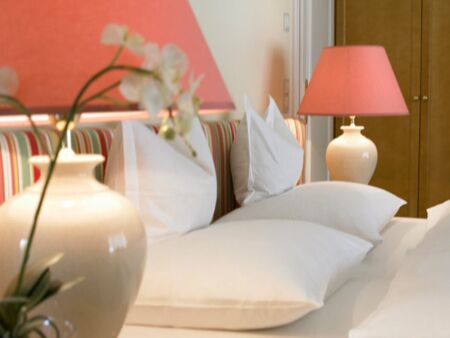 Several pillows lie on a bed