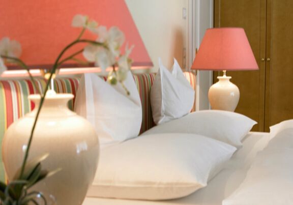 Several pillows lie on a bed