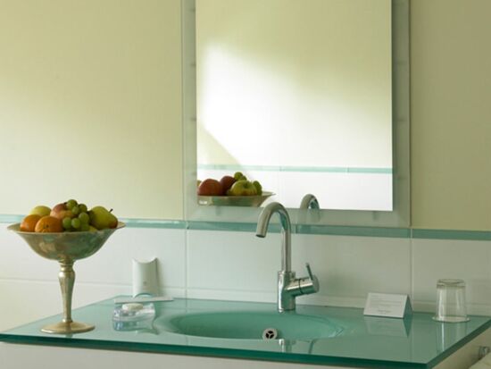 A modern bathroom with large games above the sink